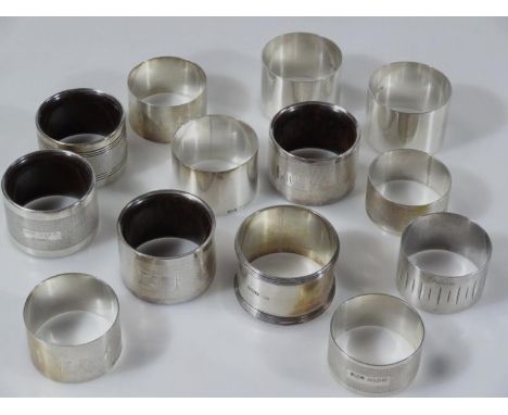 Various napkin rings, of circular outline to include part engine turned sets, 4cm dia. etc, George V and later, 13oz all in. 