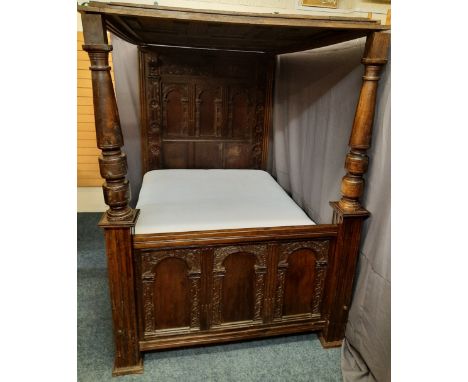 ANTIQUE OAK FULL TESTER BED, 18TH CENTURY &amp; LATER, with profuse carved detail, panelled canopy and arched with pillar car