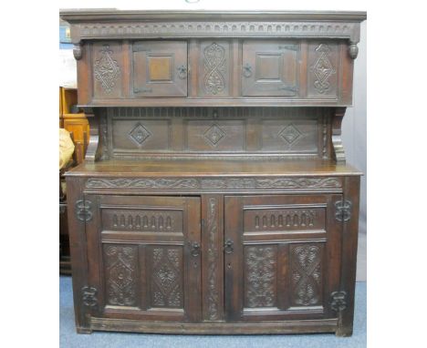 17TH CENTURY &amp; LATER OAK BUFFET SIDEBOARD DATED 1696 WITH INITIAL 'T F', the upper section with twin cupboard doors, carv