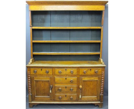 NORTH WALES OAK DRESSER with three shelf rack over three drawers, two base cupboards with three central blind drawers, ½ bobb