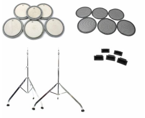 Six Remo drum practice pads, each fitted with Piezo transducers; together with two Premier cymbal stands and a quantity of bl
