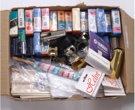 Assorted reeds, ligatures and caps for saxophone and clarinet; also two saxophone mouthpieces, cloths, swags, pull-throughs a