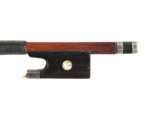 French silver mounted violin bow by and stamped Louis Bazin, the stick round, the ebony frog inlaid with pearl eyes and the e