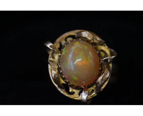 Gold ring, (Hallmark rubbed) set with mystique Opal