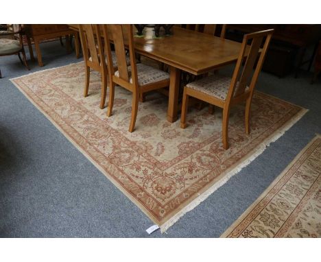 A Zeigler Design Carpet, the straw field of serreted flowerheads enclosed by similar borders, 316cm by 242cm