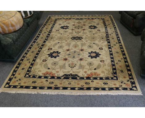 A Zeigler Design Carpet, the cream field of serreted leafy vines enclosed by meandering vine borders, 265cm by 180cm