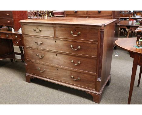 A George III Mahogany Four Height Straight Fronted Chest of Drawers, with moulded canted rectangular top, fluted quarter colu