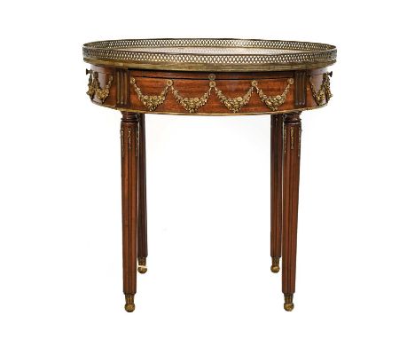 A French Marble Top Circular Mahogany Occasional Table, with two drawers, having pierced brass gallery and ormolu mounts, rai