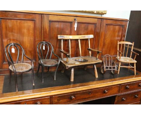 An Early 19th Century Child's Ash and Elm Commode Chair; together with a pair of ebonised Thanet Style dolls chairs and two o