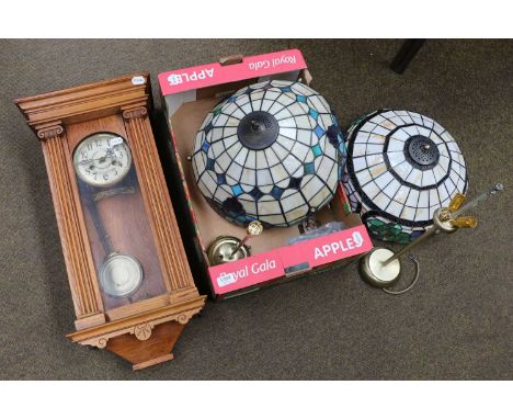 Two Tiffany style table lamps, together with an oak striking wall clock