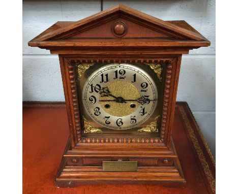 A Striking Table Clock, movement stamped DRGM, case front with presentation plaque dated Sept 1908, 39cm high, together with 