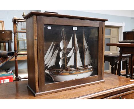 A Mid 20th Century Scratch Built Model of a Three Masted Ship, in a glazed mahogany display case, 63cm by 22cm by 53cm