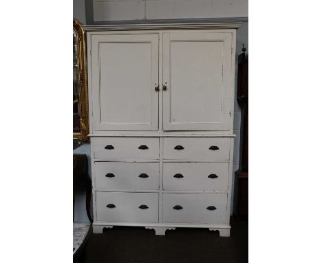 A George III White Painted Pine Housekeepers Cupboard, two cupboard doors popening to reveal fitted shelves over a bank of si