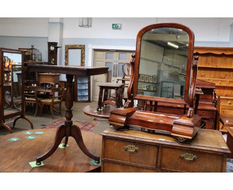 A Victorian Mahogany Dressing Table Mirror, with reeded scolling supports, raised on a reverse breakfront serpentine base wit
