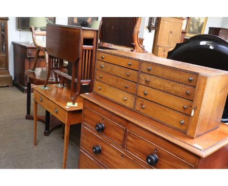 An Early 20th Century Oak Stationary Cabinet, comprising two columns of four drawers, 84cm by 28cm by 32cm; together with a V