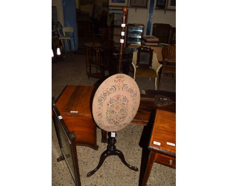 19TH CENTURY MAHOGANY POLE SCREEN DECORATED WITH OVAL NEEDLEWORK PANEL AND SET ON A TRIPOD BASE