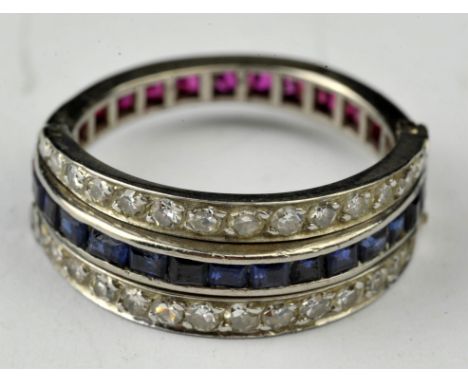 Sapphire, ruby and diamond day and night flip ring, central eternity band half set with rubies and half with sapphires, with 
