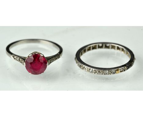 Two gem set rings, a synthetic ruby ring, with diamond shoulders mounted in platinum, ring size I½, a diamond full eternity, 