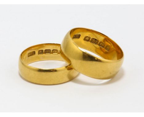 Two 22 ct yellow gold wedding bands, one 7mm, hallmarked Birmingham, 1904, ring size M, the other 5mm, hallmarked Birmingham,