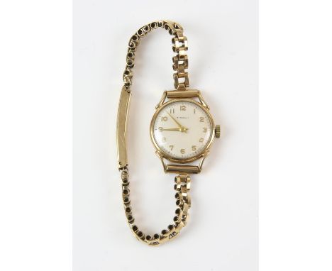 A Tissot watch, with Arabic hour markers, and silvered signed dial, with a bracelet strap, in 9 ctCondition Report:  gross we