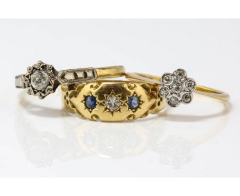 Three antique rings, including an illusion set single stone diamond ring, estimated 0.15 carat, ring size Q, a diamond floral