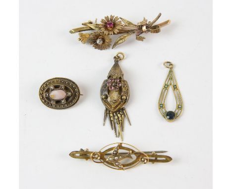 Three brooches, including a ruby and diamond floral brooch in 14 ct, a seed pearl swallow bar brooch in 9 ct, an oval brooch 
