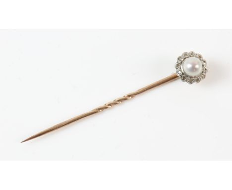 Pearl and diamond stick pin, central pearl measuring 5.6mm, with a surround of single cut diamonds, on a pin with a twisted m