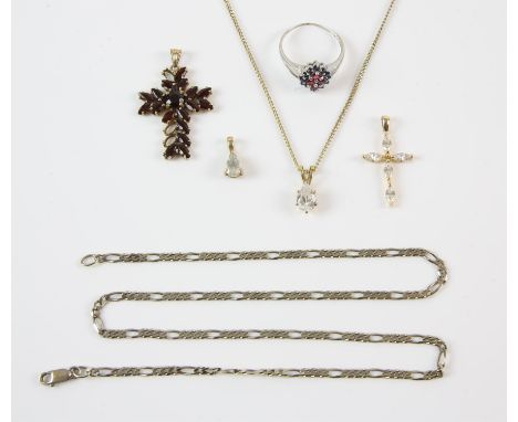 A group of jewellery including a cubic zirconia cross pendant in 14ct, a 9ct Figaro chain, cubic zirconia pendant in 9ct, a r