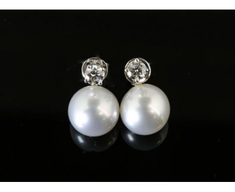 A pair of diamond and pearl earrings, round brilliant diamond studs, estimated total diamond weight 0.50 carats, with removab