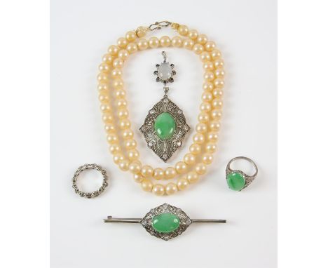 A collection of silver jewellery, including a floral moonstone pendant with a surround of sapphires, a moonstone ring, a matc