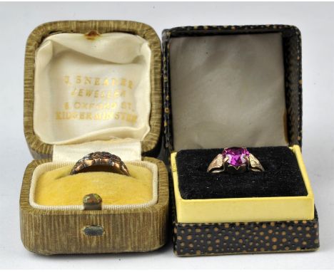 Two 9 ct gem set rings, one set with seed peals, red paste and a diamond chip in a carved design, hallmarked Chester, 1885, r