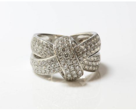 Contemporary diamond crossover ring, pavé set round brilliant cut diamonds, estimated total diamond weight 1.20 carats, mount