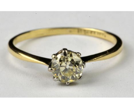 Diamond solitaire ring, old cut light yellow diamond measuring an estimated 0.68 carat claw set in a platinum mount with a 18