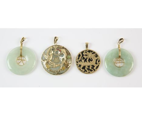 Three circular jade pendants, two with a openwork Asian character set to the centre, one with dragon motif in gold set to the