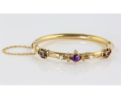 Amethyst and pearl bangle, set with three amethysts, and two pearls, on a 4.8mm hollow hinged bangle, with a safety chain, 57