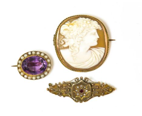 Victorian amethyst brooch, central oval cut amethyst, estimated total weight 10.49 carats, set within a border of seed pearls