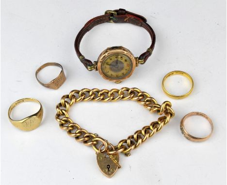 A selection of gold jewellery including three 9 ct rings, a paste set ring, and two signet rings, a 22 ct wedding band, a cur