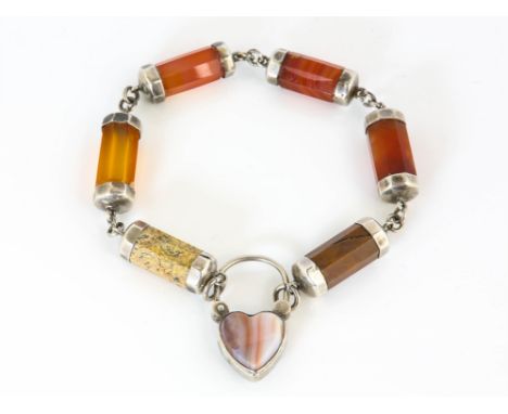 Scottish agate bracelet, six octagonal barrel links, with a variety of agate and jasper, with silver end caps, on an agate se