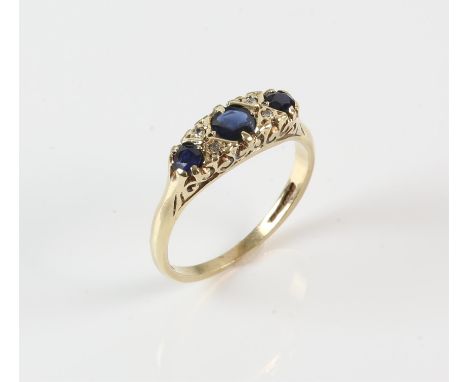 Vintage sapphire and diamond ring, set with three round cut sapphires intermittently set with Swiss cut diamonds, with carved