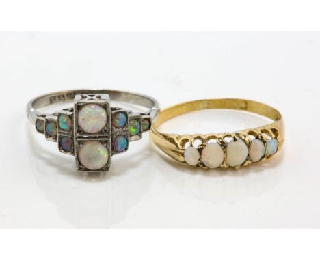 Two opal rings, including an Art Deco opal ring, set with round cabochon cut opals, stamped 18 ct plat, ring size Q, together