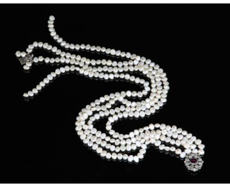 Four strand freshwater pearl necklace, approximately 6mm cream freshwater pearls, 40cm in length, with a diamond and garnet c