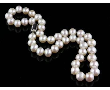 Pearl necklace, with 42 cream pearls measuring 10mm in diameter, strung with knots, 46cm in length with an 18 ct white gold p