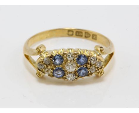 Edwardian sapphire and diamond ring, with four round cut sapphires and old cut diamonds, in 18 ct gold, hallmarked Chester 19