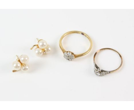 Two diamond set rings, including a diamond floral cluster ring, set with seven old cut diamonds, total estimated weight 0.26 