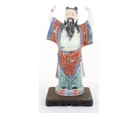 An early 20th century enamel and ceramic Chinese figure of an elder, on wood base, 32cmH