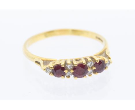 A ruby and diamond set 18ct gold half eternity ring, set with a three graduated round mixed cut rubies, and small diamond set