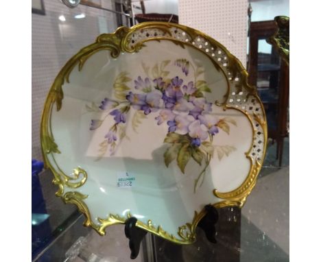 A Royal Worcester plate, circa 1900, with blue flowers and gilt border, 20cm wide. 