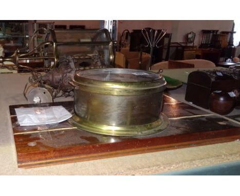 A 20th century brass porthole style wall clock, a brass lantern of serpentine form and a small Eastern copper lantern, (3). 