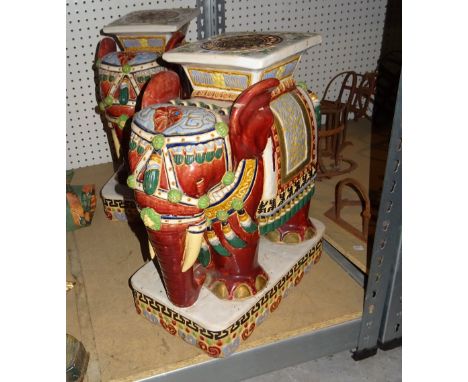 A pair of 20th century Asian ceramic garden seats formed as red elephants, 50cm high, (2). 
