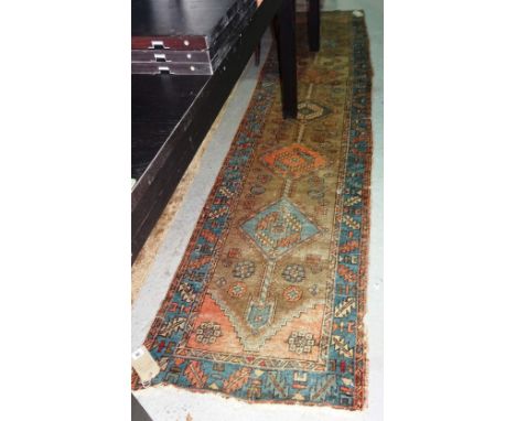 An Heriz runner, 315cm x 68cm. 